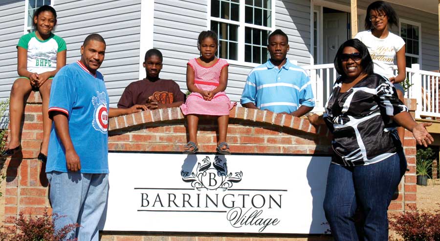 Builders of Hope neighborhood homeowners' association president Dawana Stanley and her family love their new community.